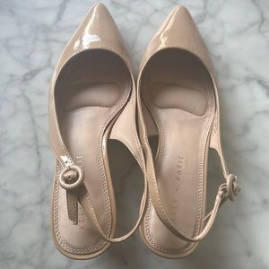 Tan, patent faux leather pumps with 1” kitten heel. Worn once. In box size 7.